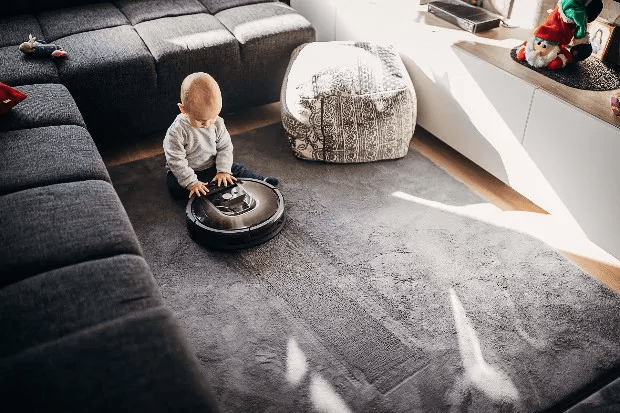 baby with smart vacuum cleaner 
