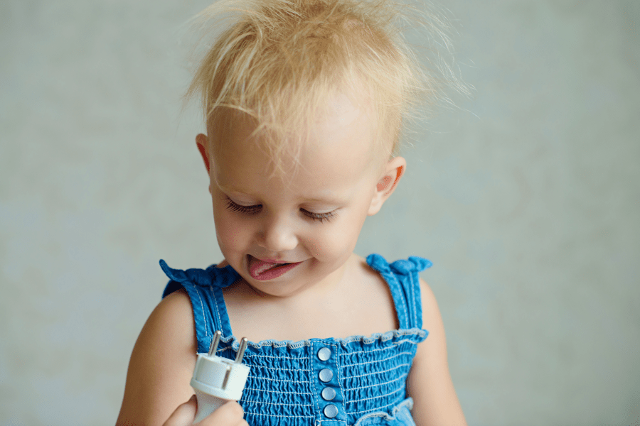 Toddler with electric cable