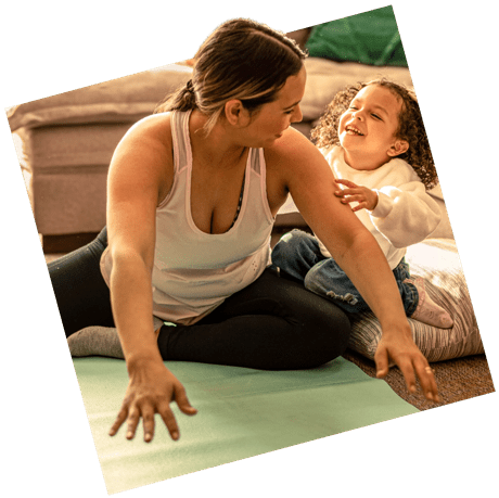 Woman and child playing on the floor