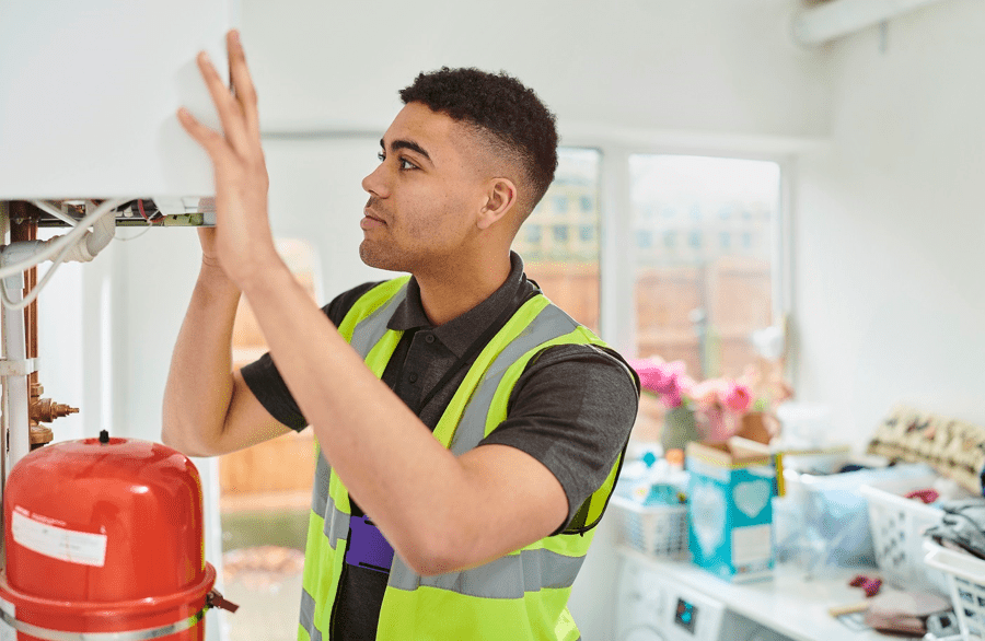 Engineer repairing a boiler