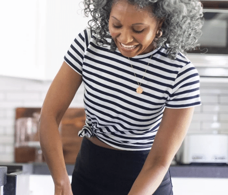 A person preparing food in the kitchen