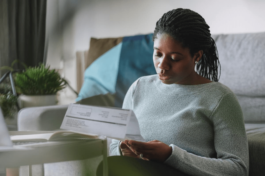A woman looks at her energy bills