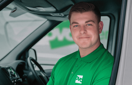 An OVO engineer in a green polo top