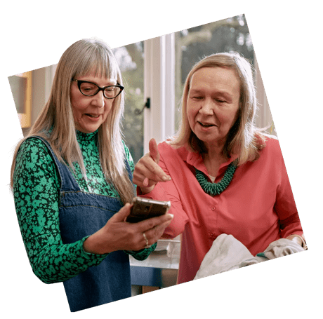 Two ladies looking at a phone screen