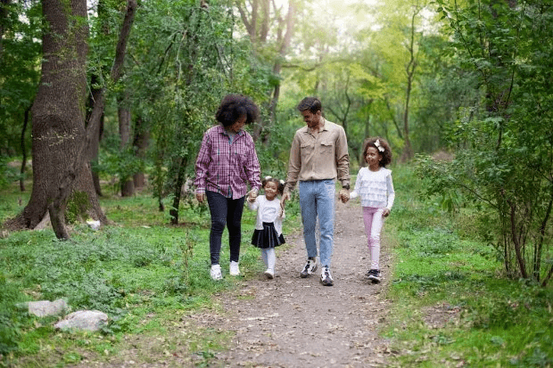 A family walking through the forest