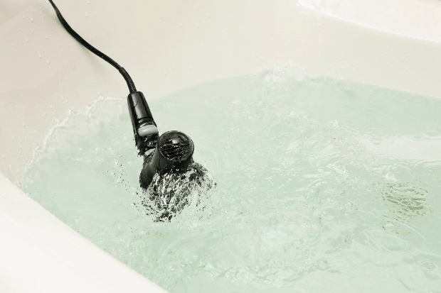 Hair dryer in bath