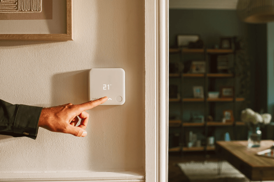 Hand pointing at thermostat