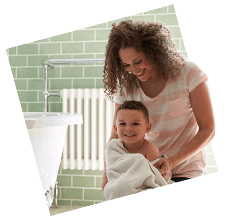 Family in bathroom smiling