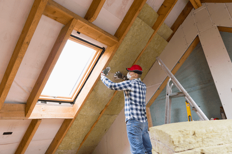 Engineer installing roof insulation