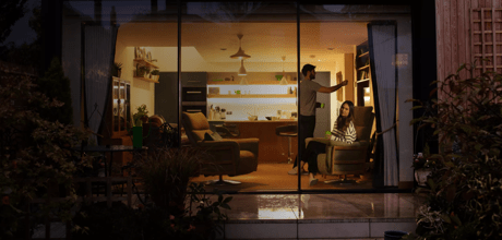 Couple at home in their lounge at night