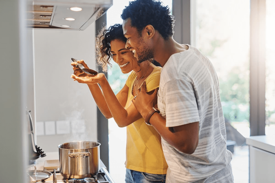 A couple cooking dinner