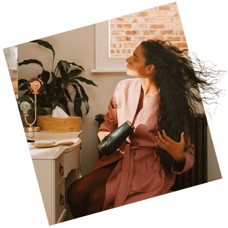 woman using hairdryer