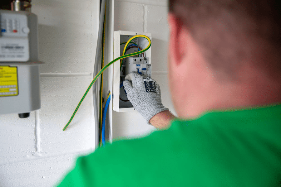 OVO engineer works on the fuse board