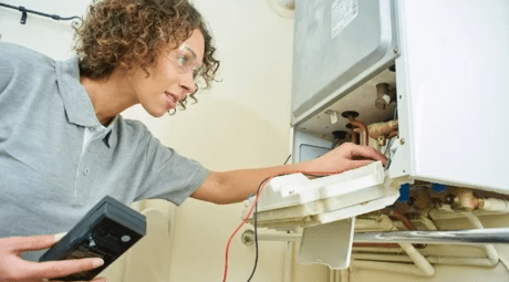 An engineer working on a boiler