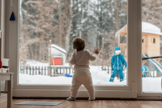 baby looking out of the window