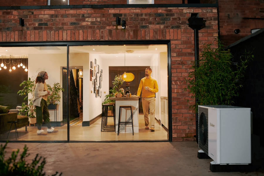 OVO customers in kitchen with heat pump outside