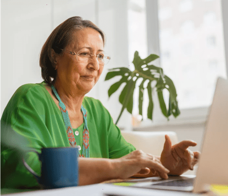 A woman typing on her laptop