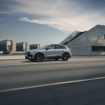 Audi driving along road
